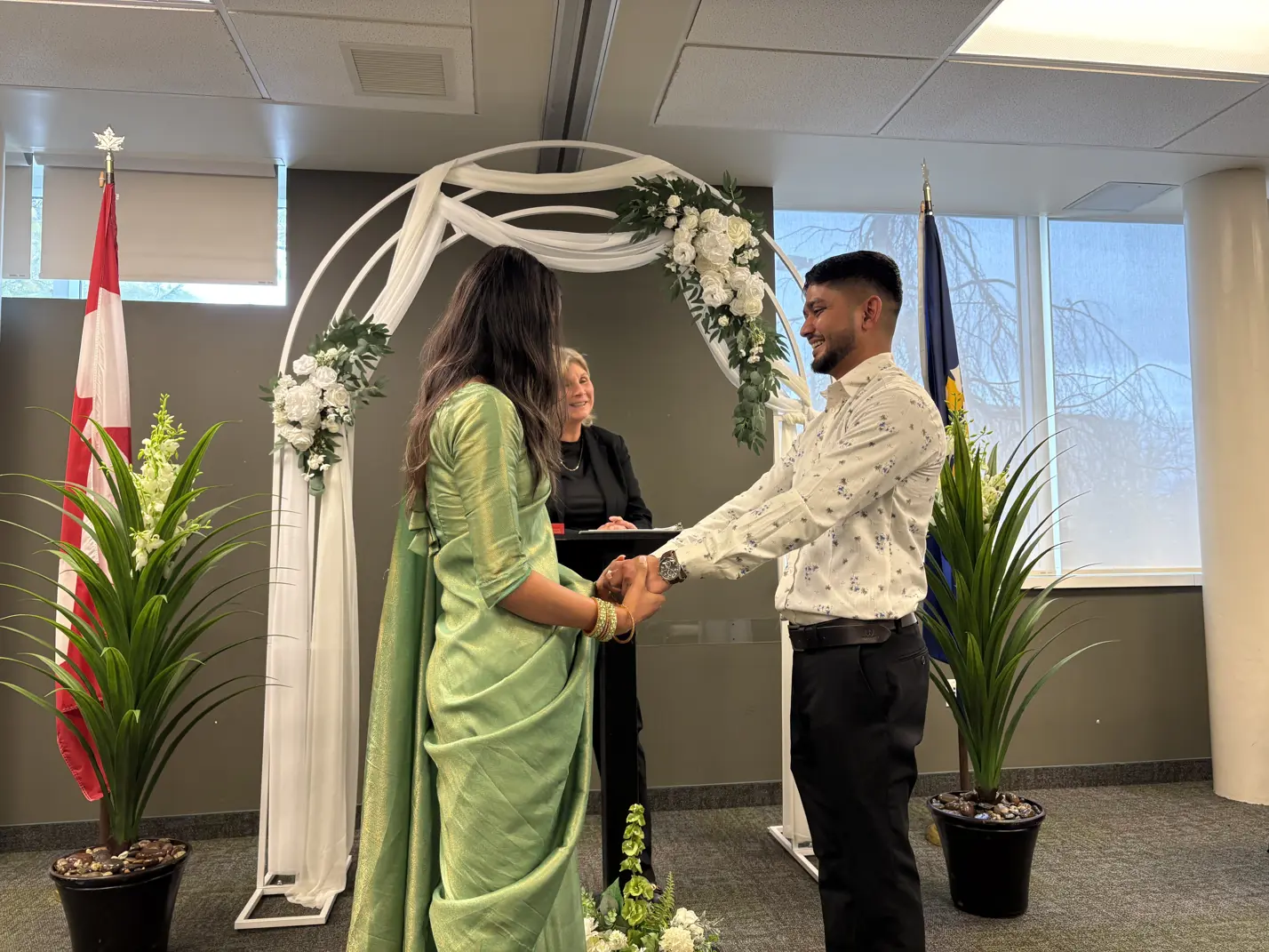 Couple with officiant at altar