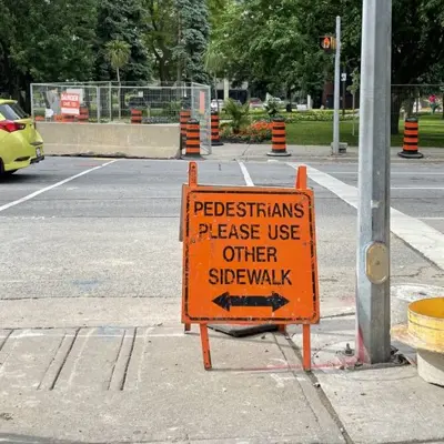 Sign at a sidewalk closure