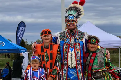 Indigenous presenters standing on stage