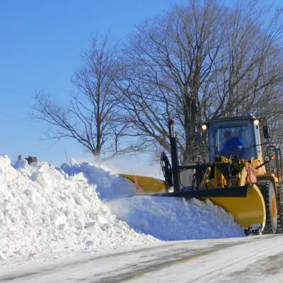 Loader plowing snow
